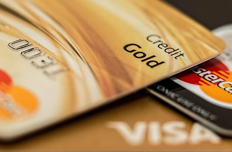 Close-up view of Visa and Mastercard credit cards placed on a table for online merchant payments